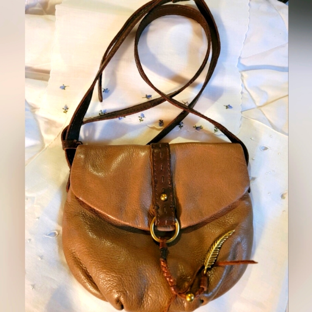 LUCKY LEATHER PURSE WITH  BRASS CHARMS NEVER USED